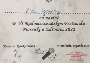Dyplom dla Mai za udział w festiwalu.